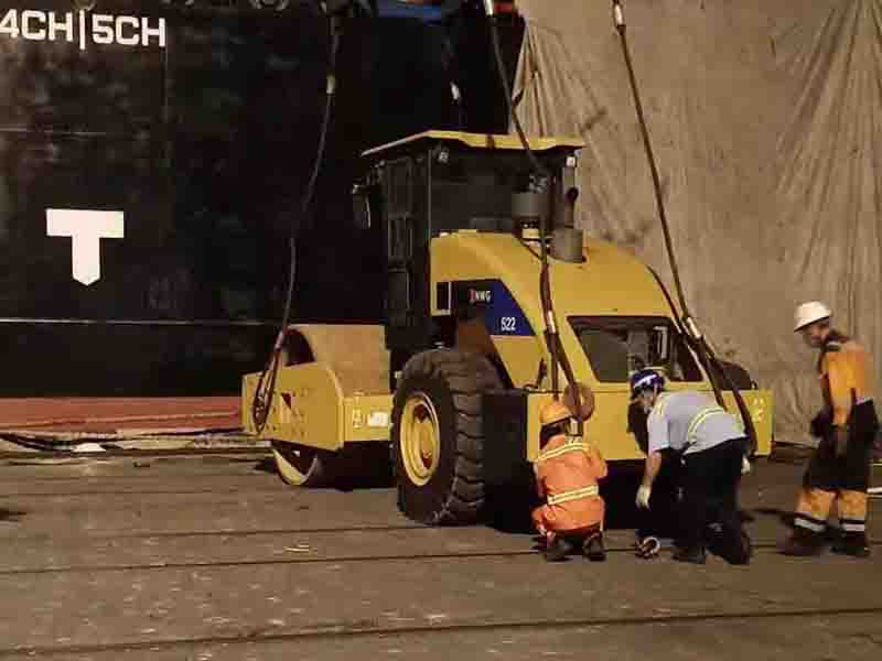 Engineering vehicles & dump trucks boarding the vessel